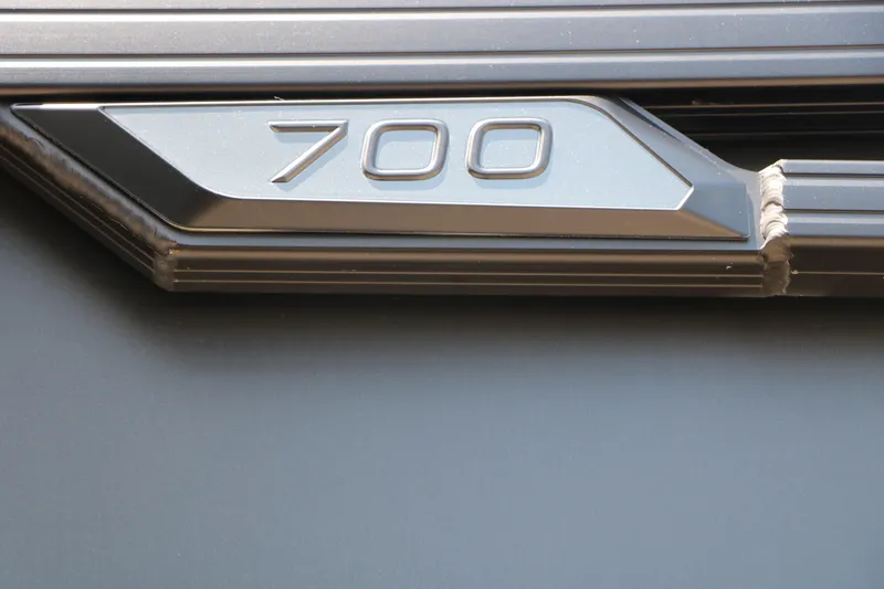 Slide: The Image of Close-up of Evotti 725 CS Arch Tri-Toon 2026, featuring '700' emblem detail. - 20