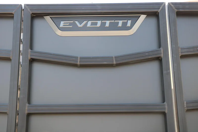 Slide: The Image of Evotti 725 CS Arch Tri-Toon 2026 boat panel with logo detail. - 23