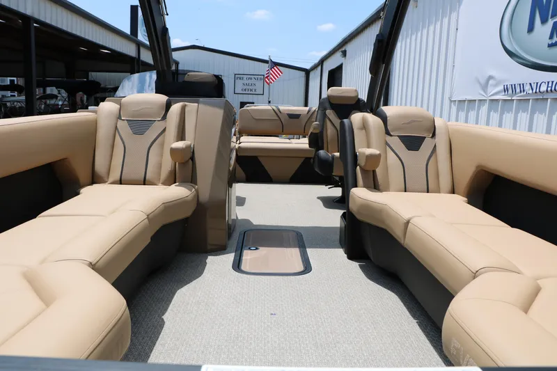 Slide: The Image of Luxurious interior of 2026 Evotti 725 CS Arch Tri-Toon boat with beige seating. - 24