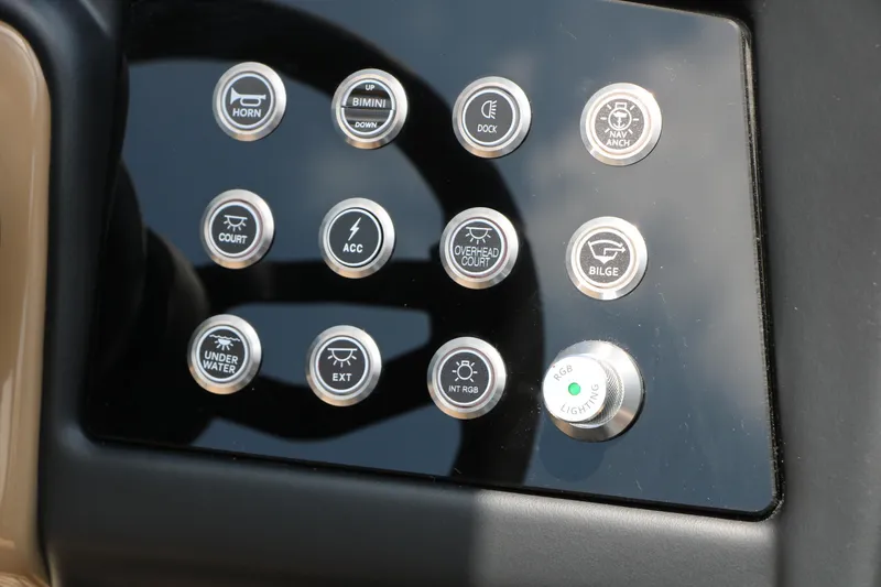 Slide: The Image of Control panel of 2026 Evotti 725 CS Arch Tri-Toon with labeled buttons and switches. - 34