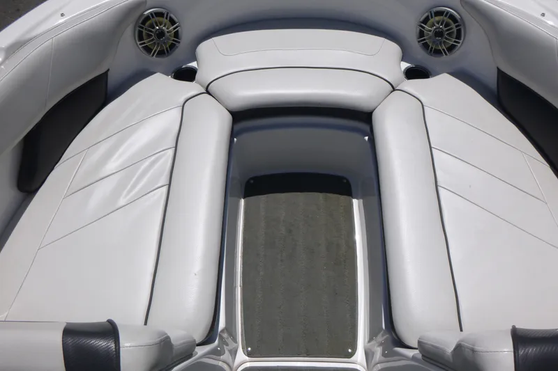 Slide: The Image of Interior seating of 2014 Yamaha Boats AR192, featuring white cushioned seats and speakers. - 7