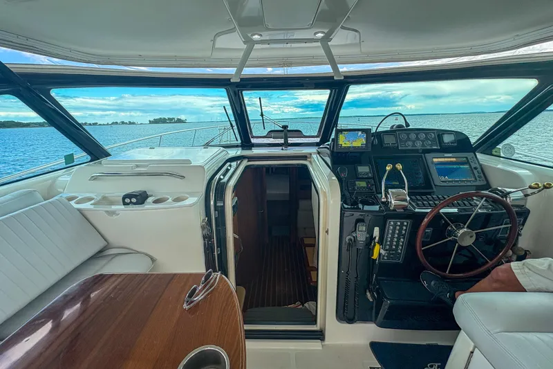 Slide: The Image of 2004 Tiara Yachts 3800 Open cockpit with navigation equipment and ocean view. - 14