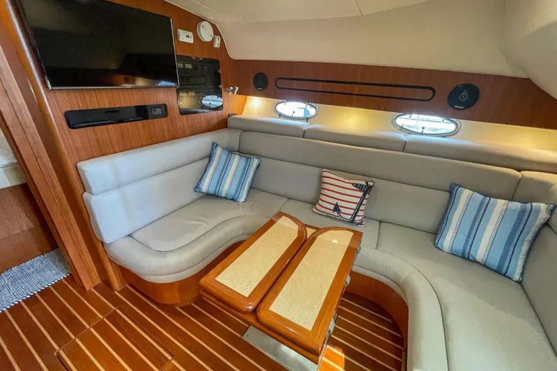 Slide: The Image of Luxurious interior of 2004 Tiara Yachts 3800 Open with plush seating and nautical decor. - 20