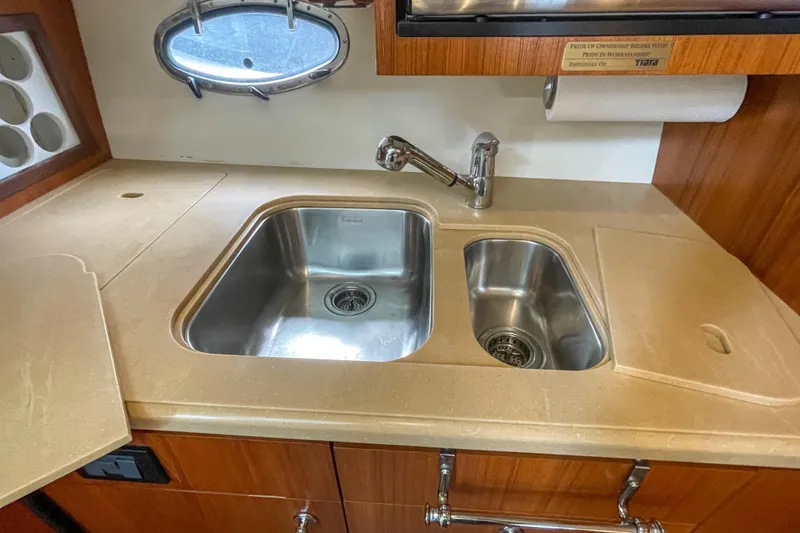 Slide: The Image of 2004 Tiara Yachts 3800 Open kitchen sink with dual basins and faucet. - 25