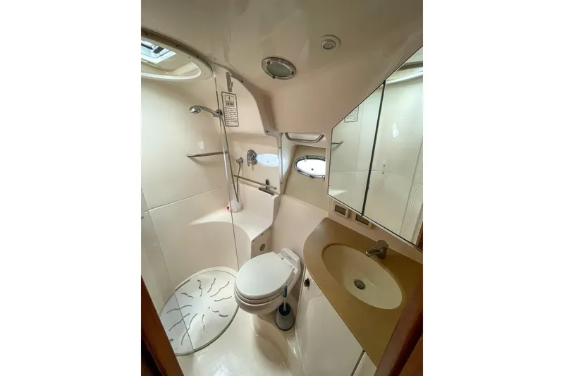 Slide: The Image of Bathroom interior of 2004 Tiara Yachts 3800 Open, featuring shower and sink. - 28
