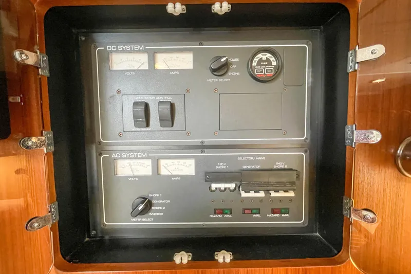 Slide: The Image of Electrical control panel on a 2004 Tiara Yachts 3800 Open, featuring DC and AC systems. - 30