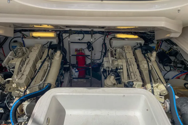 Slide: The Image of Engine room of a 2004 Tiara Yachts 3800 Open, featuring dual engines and equipment. - 32
