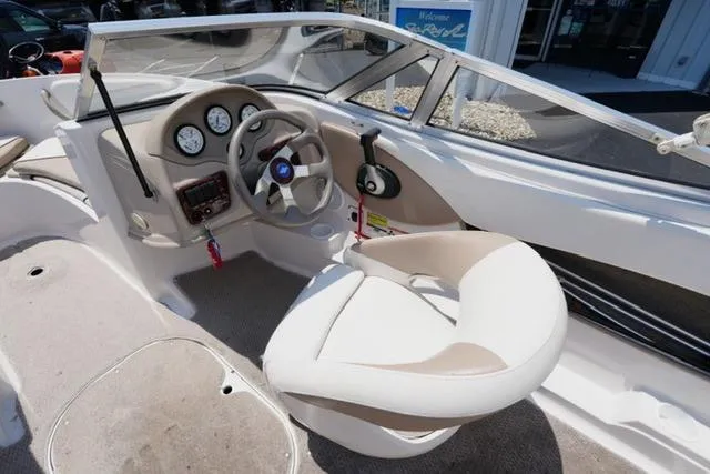Slide: The Image of 2006 Four Winns 183 Horizon Fish & Ski boat interior with steering wheel and dashboard. - 11