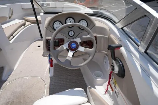 Slide: The Image of 2006 Four Winns 183 Horizon Fish & Ski boat dashboard with steering wheel and gauges. - 12