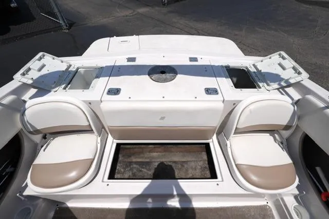 Slide: The Image of 2006 Four Winns 183 Horizon Fish & Ski boat interior with seating and storage compartments. - 14