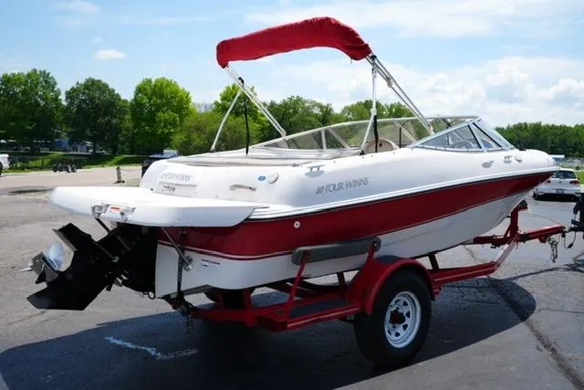 Slide: The Image of 2006 Four Winns 183 Horizon Fish & Ski boat on trailer, red and white design. - 5