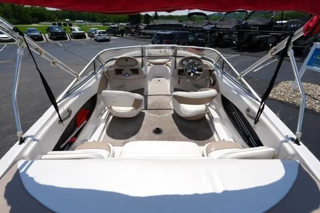 Slide: The Image of 2006 Four Winns 183 Horizon Fish & Ski boat interior with seating and steering wheel. - 7