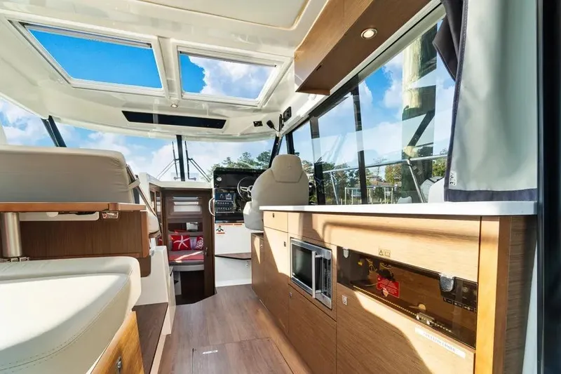 Slide: The Image of Interior of 2021 Jeanneau NC 1095 boat with modern design and panoramic windows. - 11