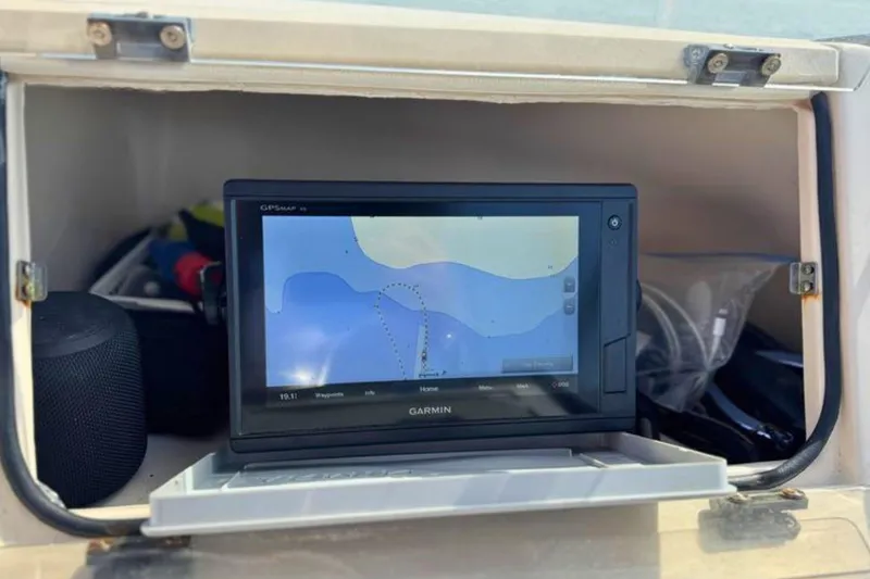 Slide: The Image of Garmin GPS device in a 2006 Grady-White Freedom 225 boat compartment. - 12