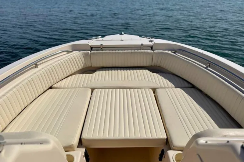 Slide: The Image of Grady-White Freedom 225 boat interior, 2006 model, featuring spacious seating on calm water. - 13