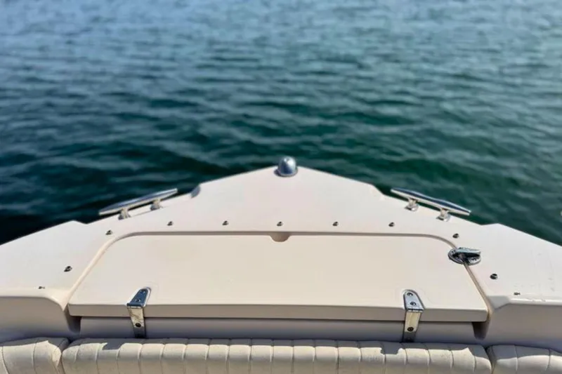 Slide: The Image of Bow view of 2006 Grady-White Freedom 225 boat on calm water. - 15