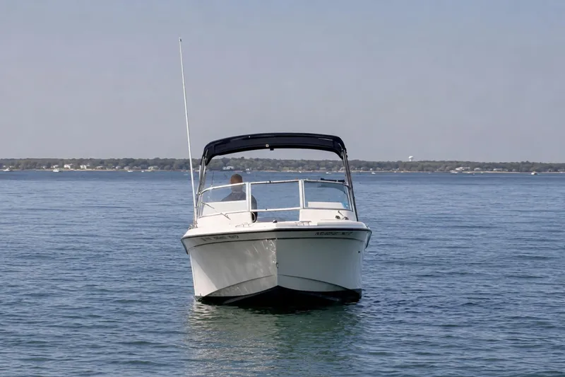 Slide: The Image of 2006 Grady-White Freedom 225 boat on calm water, front view. - 6