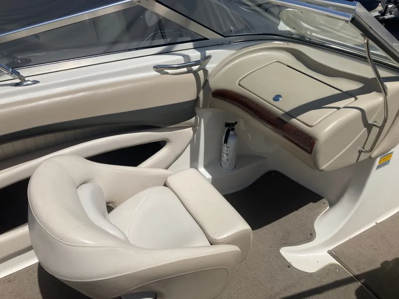 Slide: The Image of Interior of a 2006 Glastron GX 205 boat with seat and dashboard. - 11