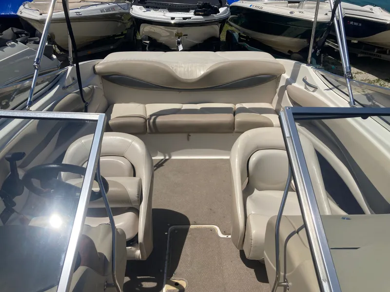 Slide: The Image of Interior of a 2006 Glastron GX 205 boat with beige seating. - 14
