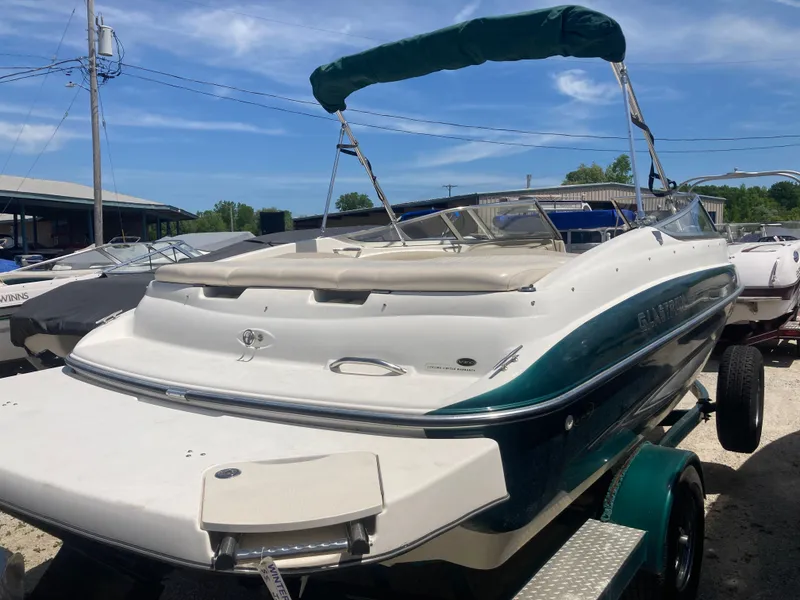 Slide: The Image of 2006 Glastron GX 205 boat with green canopy on trailer. - 5