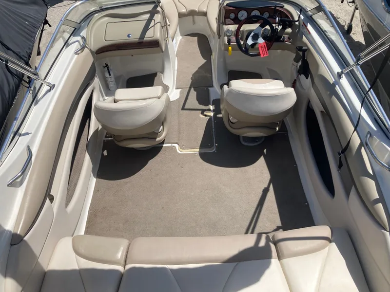 Slide: The Image of Interior of a 2006 Glastron GX 205 boat with beige seating. - 7