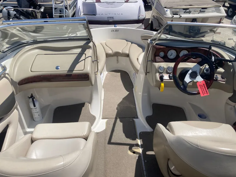 Slide: The Image of Interior of a 2006 Glastron GX 205 boat with steering console. - 8