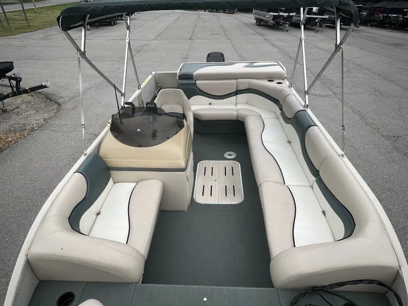 Slide: The Image of 2001 Sun Tracker Party Deck boat with seating and canopy. - 12