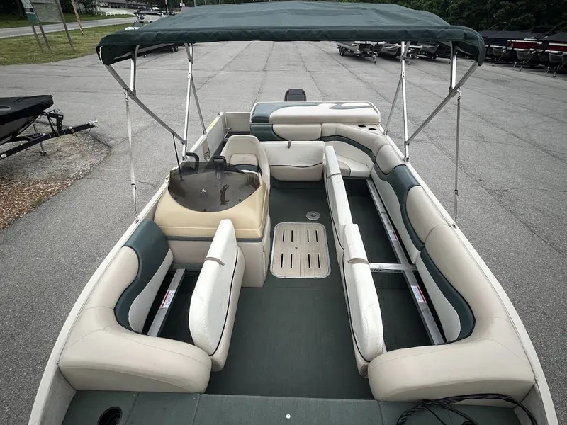 Slide: The Image of 2001 Sun Tracker Party Deck pontoon boat with seating and canopy. - 13