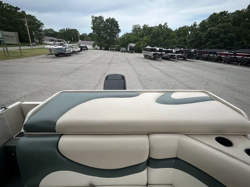 Slide: The Image of 2001 Sun Tracker Party Deck boat in parking lot. - 16