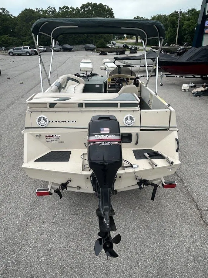 Slide: The Image of 2001 Sun Tracker Party Deck boat with outboard motor. - 3