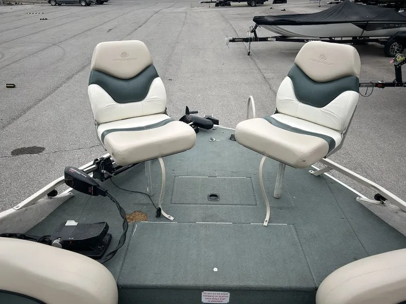 Slide: The Image of 2001 Sun Tracker Party Deck boat with two seats on the deck. - 9