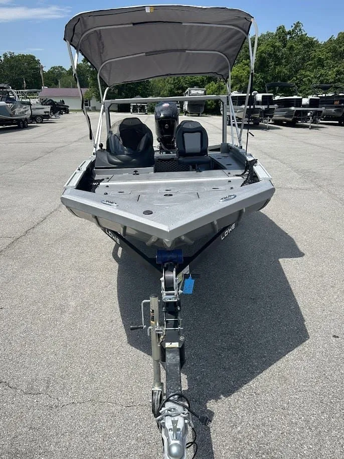 Slide: The Image of Lowe Outlet 20 boat 2025 with canopy on trailer. - 6
