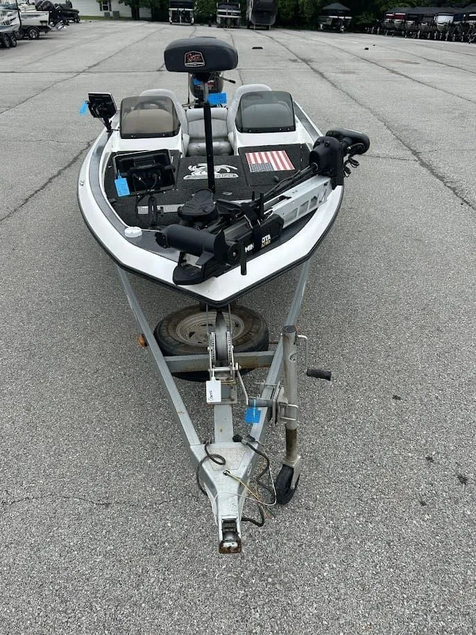 Slide: The Image of 1997 Champion 191 DC boat on trailer, front view. - 6