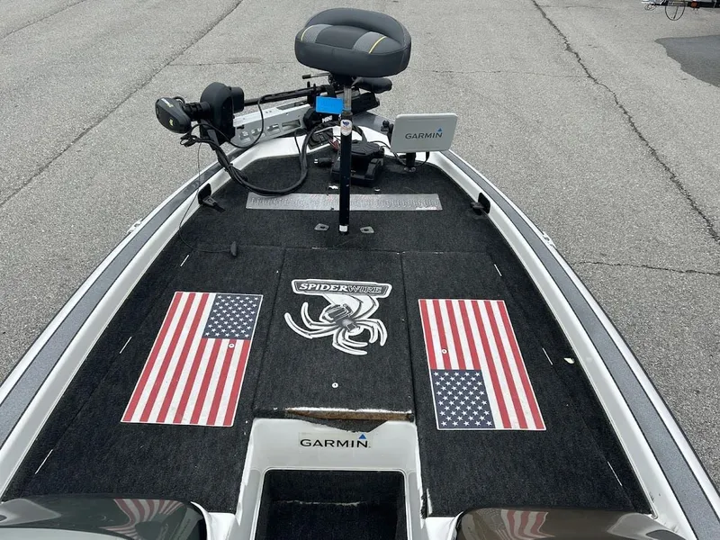 Slide: The Image of 1997 Champion 191 DC boat with Garmin and American flags. - 8