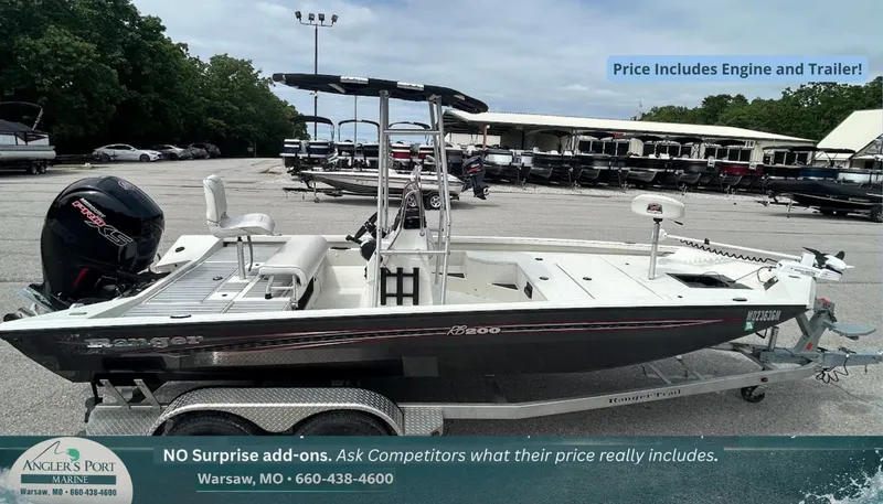 The Image of 2020 Ranger RB200 boat with engine and trailer at a marina. - 1
