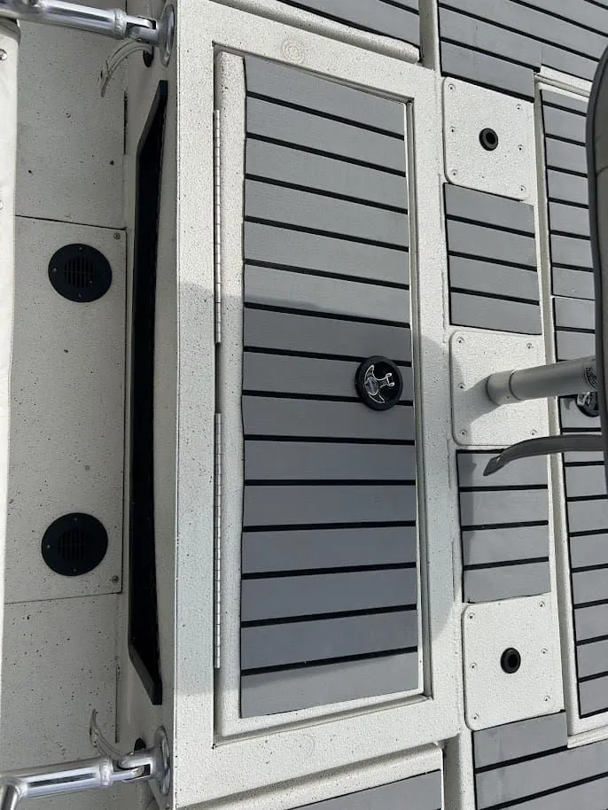 Slide: The Image of Ranger RB200 2020 boat deck with gray panels and anchor emblem. - 16
