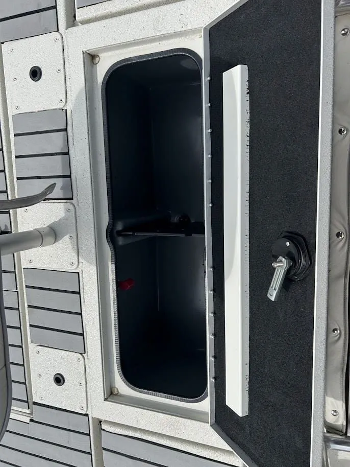 Slide: The Image of Open storage compartment on a 2020 Ranger RB200 boat. - 17