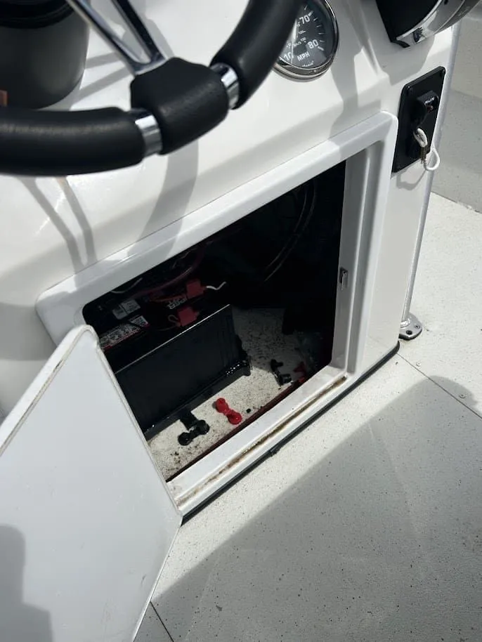 Slide: The Image of Ranger RB200 2020 boat console with open battery compartment. - 9