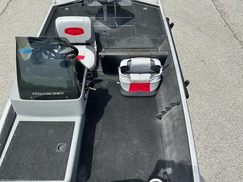 Slide: The Image of 2016 Tracker Pro 160 boat interior with seats and steering console. - 14