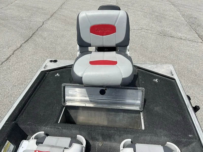 Slide: The Image of 2016 Tracker Pro 160 boat with gray seat and storage compartment. - 16