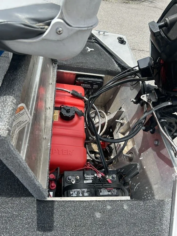 Slide: The Image of Interior view of a 2016 Tracker Pro 160 boat with battery and wiring. - 18