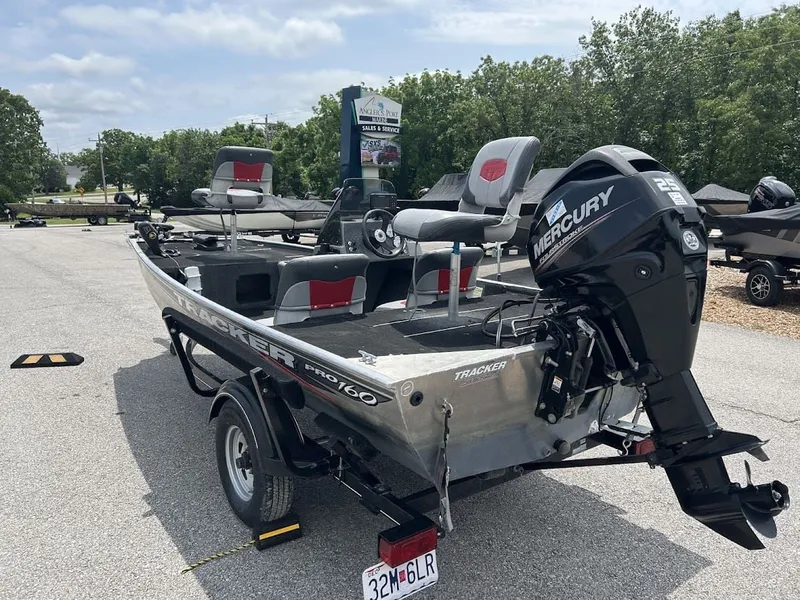Slide: The Image of 2016 Tracker Pro 160 boat with Mercury engine on parking lot. - 4