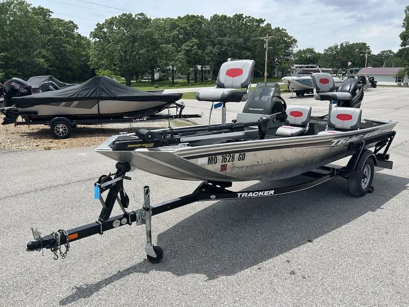 Slide: The Image of 2016 Tracker Pro 160 boat parked on trailer outdoors. - 5
