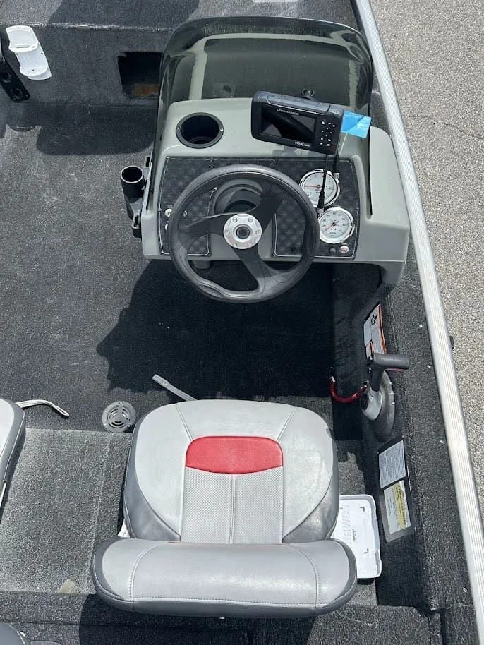 Slide: The Image of Interior of a 2016 Tracker Pro 160 boat with steering console. - 7