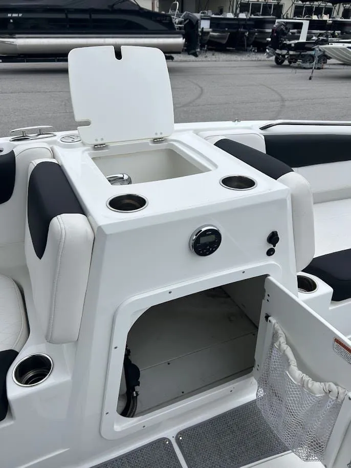 Slide: The Image of Interior of a 2019 Tahoe 2150 boat with storage and cup holders. - 12