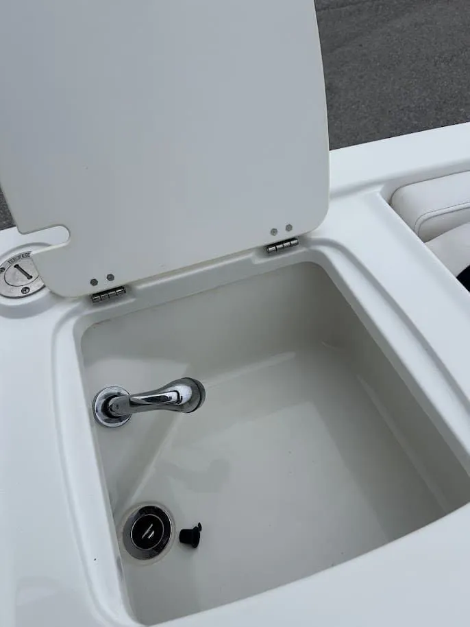 Slide: The Image of Open storage compartment in 2019 Tahoe 2150 boat. - 13