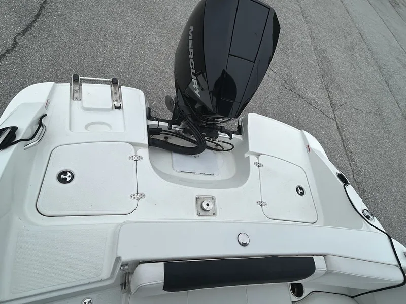 Slide: The Image of Rear view of a 2019 Tahoe 2150 boat with Mercury outboard motor. - 21