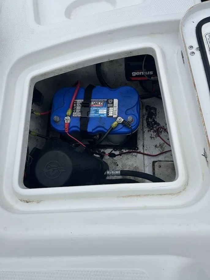Slide: The Image of Battery compartment of a 2019 Tahoe 2150 boat with Optima battery. - 22