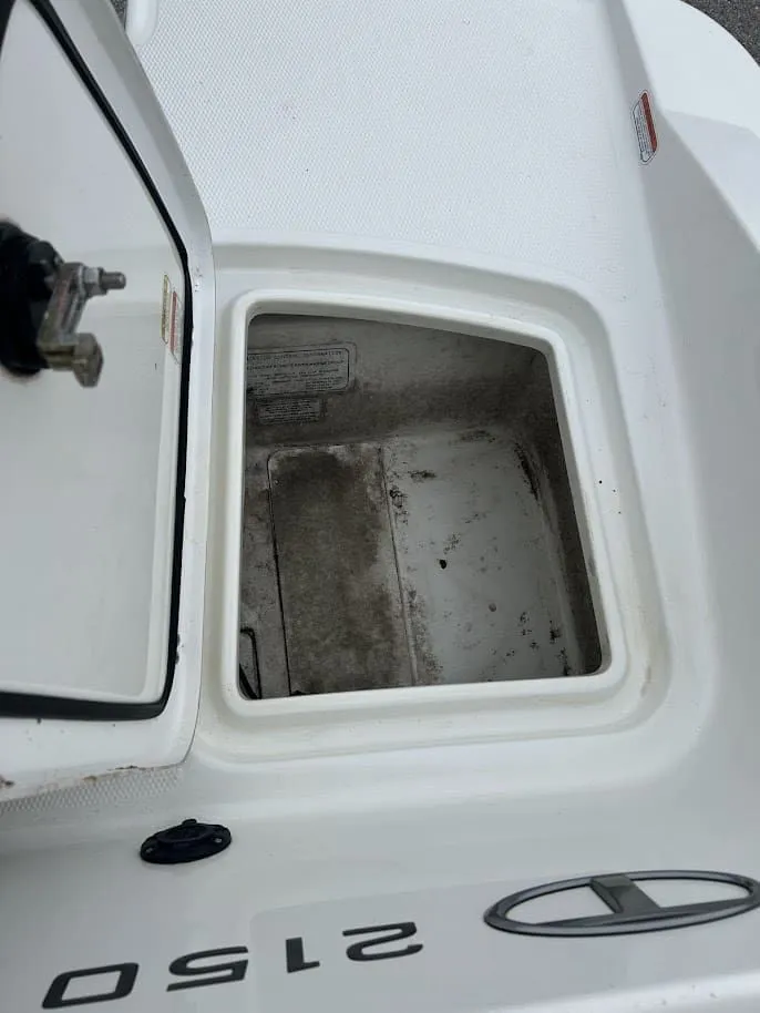 Slide: The Image of Open storage compartment in 2019 Tahoe 2150 boat. - 23