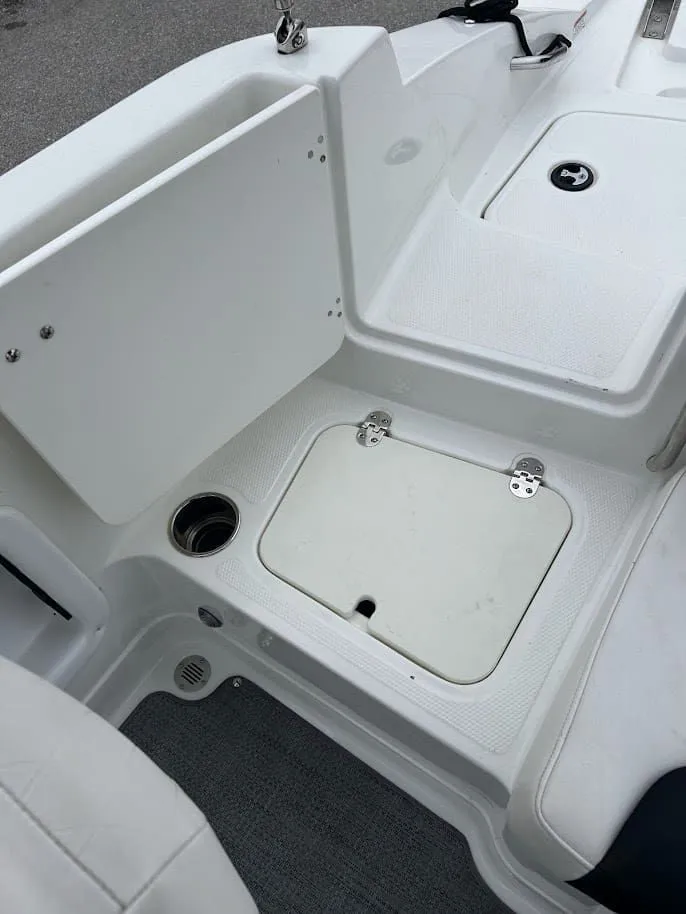 Slide: The Image of Interior of a 2019 Tahoe 2150 boat with storage compartment. - 24